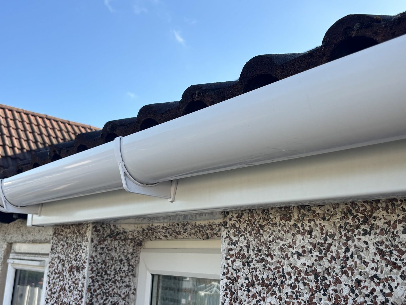 Spotless white fascia and guttering after cleaning